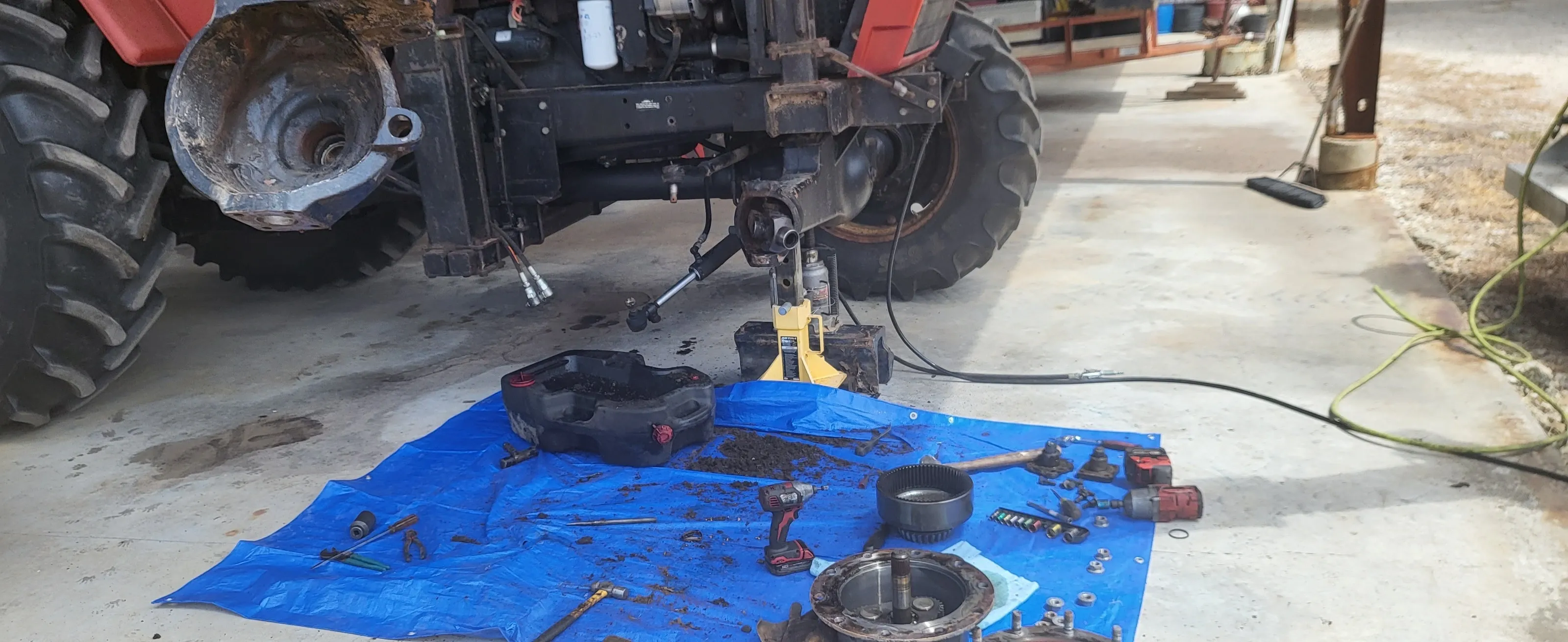 Close-up of heavy machinery repair.