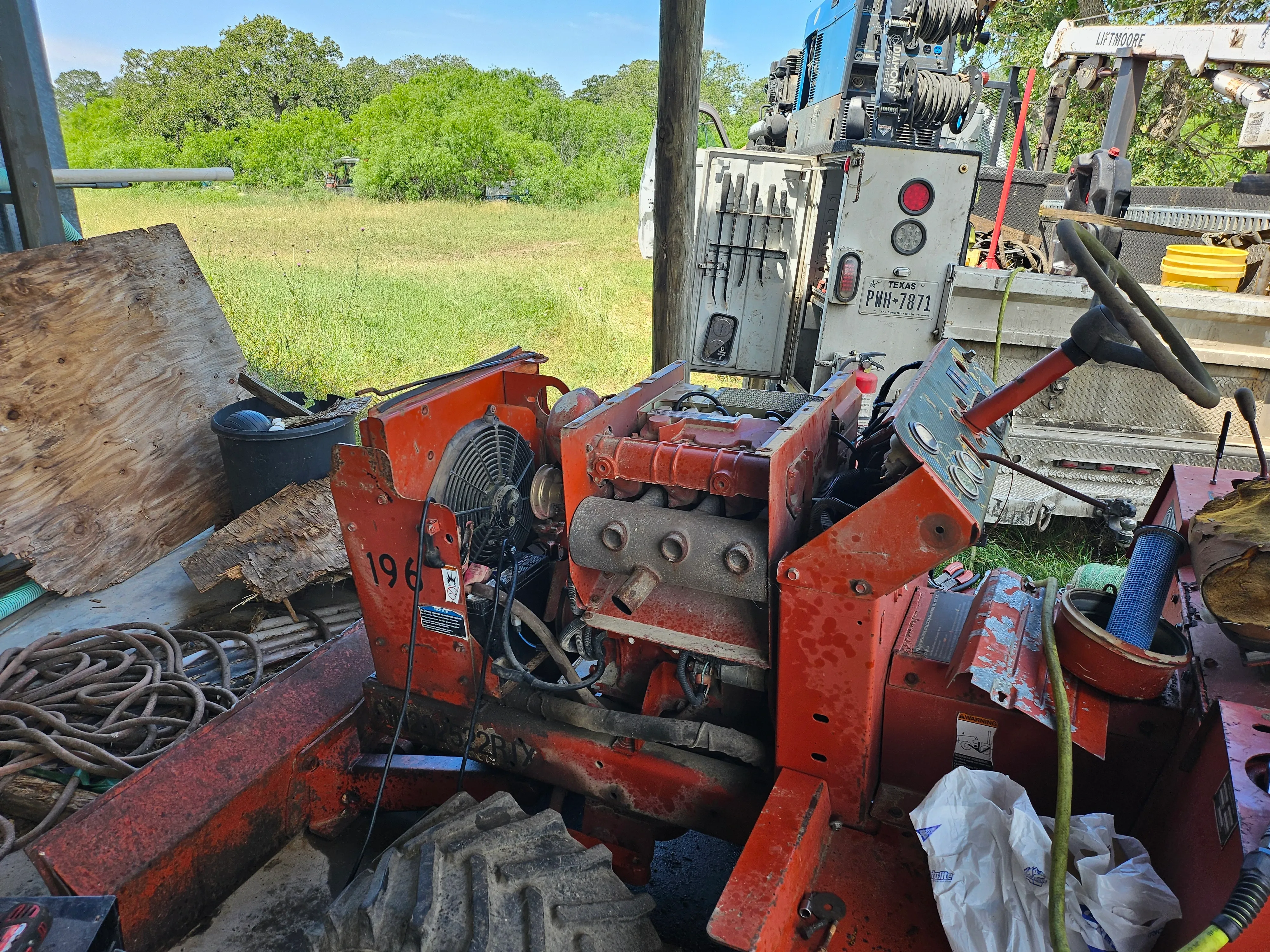 Disassembled engine or machinery parts, with various components visible.